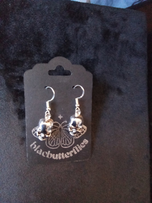 Blacbutterflies silver skull earrings