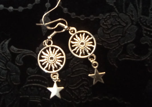 Blacbutterflies enclosed sun with hanging star