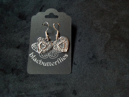 Blacbutterflies ' holding tin man's heart' earrings